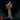 Nihiloor mind flayer by Monster Atlas, standing upright in tattered robes, holding a clawed intellect devourer against its chest with long bony fingers, tentacled face visible, ornate shoulder pauldrons detailed with angular plating.