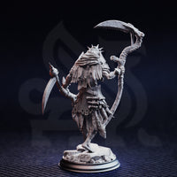 Unpainted grey resin miniature of Norminos the Flesh Reaper — three-quarter rear view highlighting the layered tattered robes, armour plating, bone-vertebrae scythe shaft, and detailed cracked rubble base