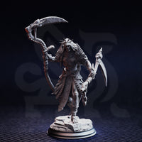 Unpainted grey resin miniature of Norminos the Flesh Reaper — front view showing full detail of the bone scythe, chained hooked blade, spiked crown, and cracked stone scenic base against a dark studio background
