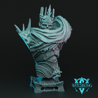 Digital render of the Once Dead King bust by Witchsong Miniatures — an unpainted teal-grey resin sculpt showing an undead monarch with a jagged bone crown, sunken corpse-like face, fur-trimmed tattered cloak draped over one shoulder, and layered spiked plate armour, mounted on a sculpted stone base