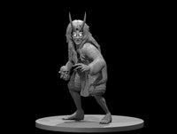 Crouching female Oni miniature with twin horns, long wild hair, and a wide leering grin, clutching a skull in one clawed hand. Loose robes, bare feet. Sculpt by MZ4250.
