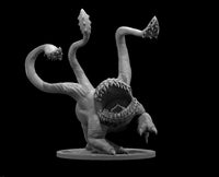 Otyugh miniature by MZ4250 — a squat, three-legged creature crouching low, its body dominated by a wide-open circular maw lined with multiple rows of jagged teeth. Three long tentacles extend upward, each tipped with a spined, club-like barb. The skin is textured and fleshy, with visible scales around the mouth. The pose is hunched and predatory, claws splayed on a plain round base.