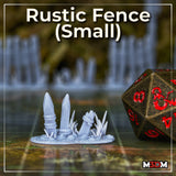Unpainted grey resin print of the small rustic fence terrain piece by Mia Kay M3DM — two shorter stakes at staggered heights with rope bindings and ground scatter detail, shown next to a D20 die for scale on a tabletop gaming mat