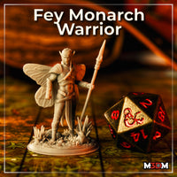 Photograph of the printed Fey Monarch Warrior miniature in unpainted grey resin, standing on a tabletop map alongside a large D20 dice. The winged fey warrior holds a spear and stands on a sculpted crystal and stone base, showing the print quality and scale of the finished miniature.