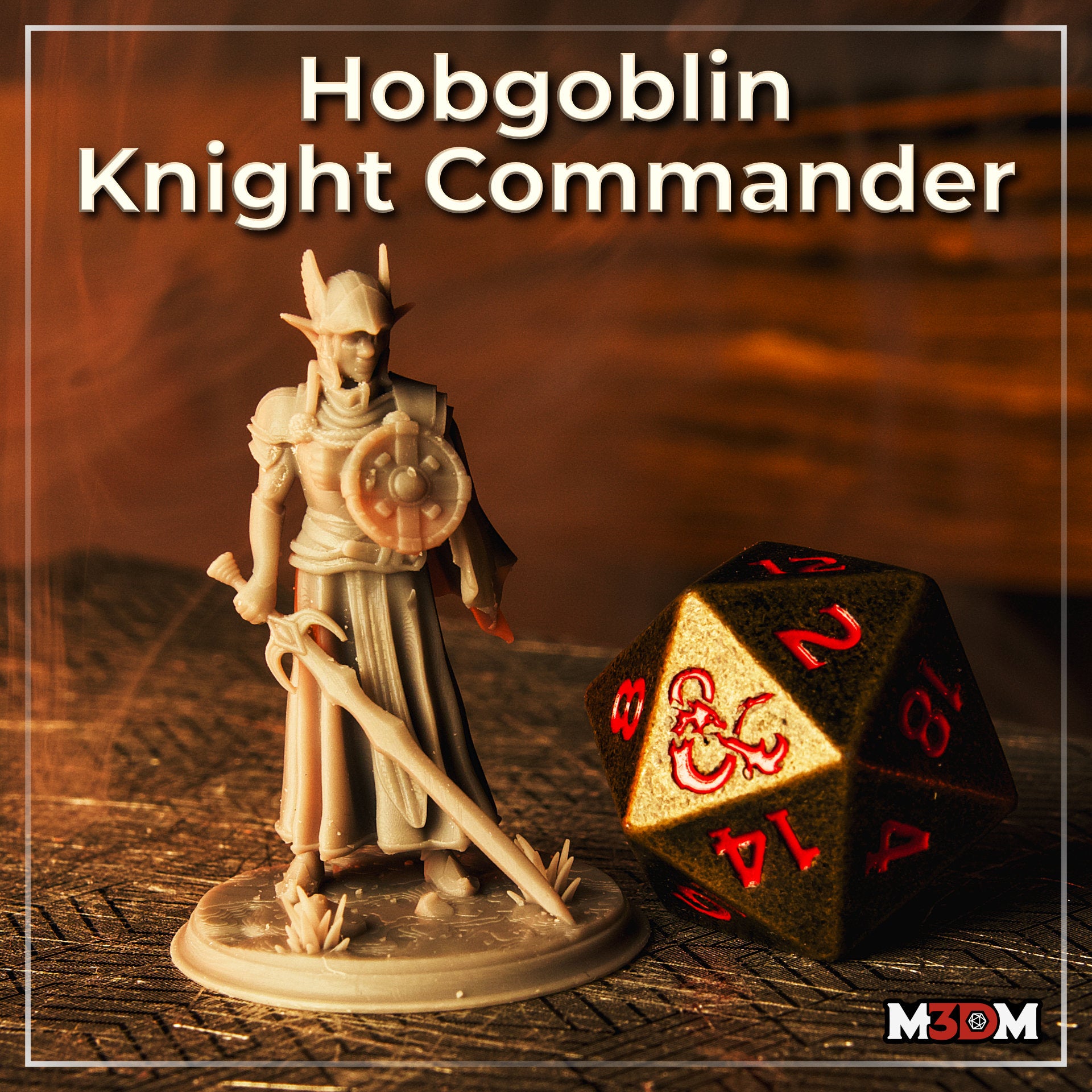 Photograph of a printed and unpainted Hobgoblin Knight Commander resin miniature by M3DM, shown in three-quarter view alongside a black and gold D20 die for scale. The figure displays clear detail on the armour, shield, greatsword, and scenic base.