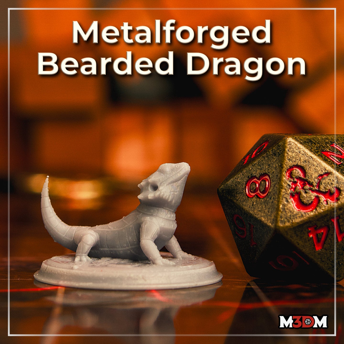 Printed and unpainted grey resin Metalforged Bearded Dragon familiar miniature on a tabletop surface, shown next to a large bronze-and-red D20 die for scale. The mini shows the armour-plated bearded dragon in its characteristic upright alert pose, with clear mechanical joint detail on the legs and segmented tail. Labelled Metalforged Bearded Dragon by M3DM.