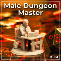 Photograph of the printed Male Dungeon Master miniature at 32mm scale — unpainted grey resin, seated at a detailed wooden table with an open book and tankard, surrounded by dice and a battle map