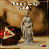 Photograph of the printed Roman Lady Noble miniature beside a large D20 die — unpainted grey resin showing a composed Roman noblewoman in flowing draped robes, standing on a plain base at 32mm scale