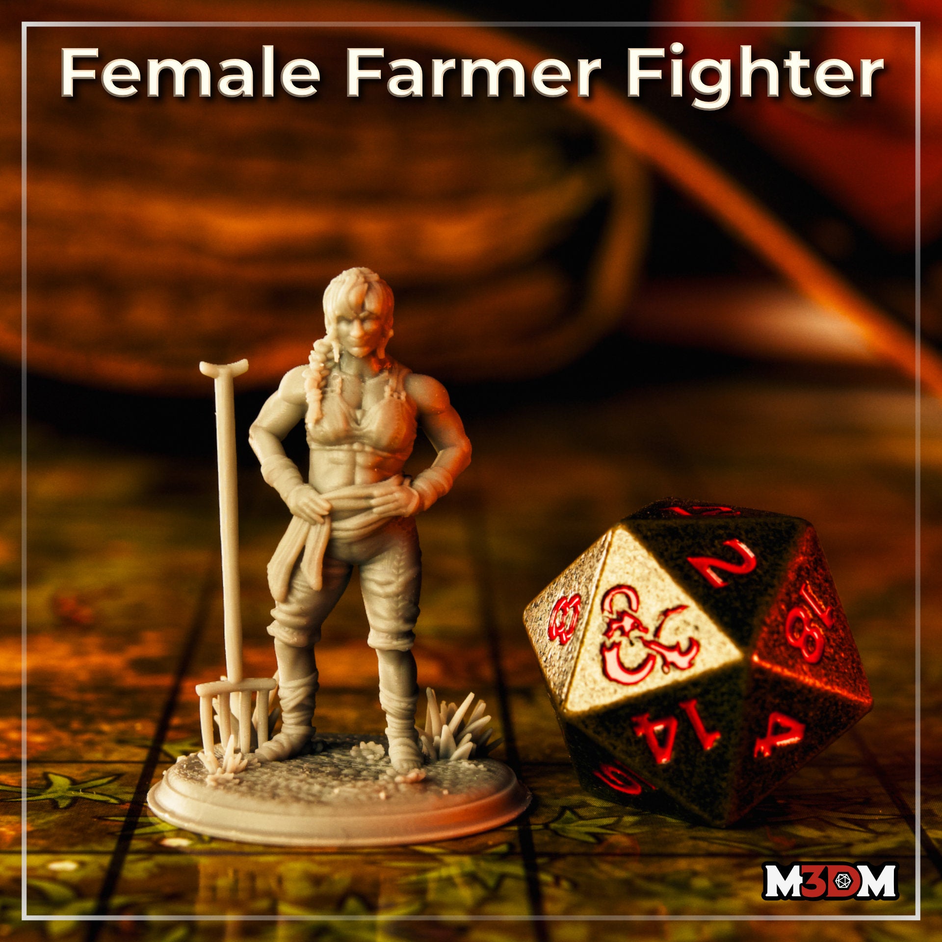 Photograph of the printed Female Farmer Fighter miniature by Mia Kay M3DM, unpainted grey resin, posed on a D&D battle map tile next to a large bronze D20 die for scale. She stands confidently with a rake, wearing patched clothing with leg wrappings, on a detailed grassy base.