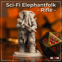 Photograph of an unpainted grey resin sci-fi Elephantfolk miniature carrying a rifle, wearing layered armour with pouches and straps, on a round base with grass tufts, shown beside a large gold D20 dice