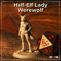 Photograph of a printed unpainted half-elf lady werewolf miniature in grey resin, posed on a textured scenic base with small plants. A large black and gold D20 dice with red Dungeons and Dragons logo is visible beside it for scale reference.