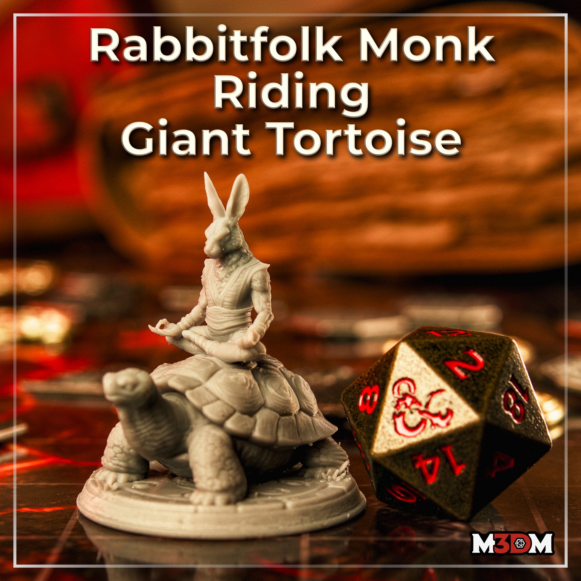 Photograph of a printed grey resin rabbitfolk monk miniature seated in meditation on a giant tortoise, shown on a tabletop next to a large D20 die, with gaming books visible in the background — 32mm scale