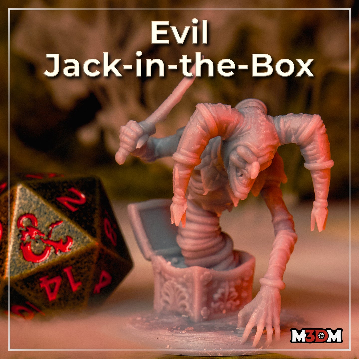 Photograph of the printed Evil Jack-in-the-Box miniature by M3DM, unpainted grey resin, showing the creature bursting from an ornate box with dagger raised and clawed hand outstretched. A D&D d20 die is visible in the foreground for scale reference.
