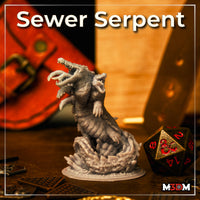 Multi-headed serpentine monster sculpt rearing upward, segmented armoured body with hooked claws, multiple gaping jaws showing recurved teeth, erupting from a shattered-ground scenic base. Mia Kay M3DM.