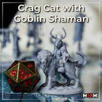 Crag Cat with Goblin Shaman Rider by Mia Kay M3DM — grey primed resin miniature shown beside a large D20 die, shaman seated atop the cat with antler headdress visible.