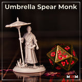 Bald monk in layered kimono robes, one hand gripping a tall ornate umbrella-spear with cloud-carved canopy, standing with composed posture on a cherry blossom scatter base. Sculpt by Mia Kay M3DM.