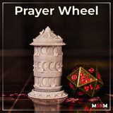 Cylindrical prayer wheel terrain piece with three carved tiers, crescent moon panels, cherry blossom clusters at each band junction, ornate frieze borders, wide floral base, and a domed engraved cap with finial. Sculpt by Mia Kay M3DM.