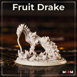 Fruit Drake by Mia Kay M3DM — serpentine drake with a leaf-fringed crest and plant-covered haunches, shown on a plain base, body curved in a sweeping arch with the head lowered toward the ground.