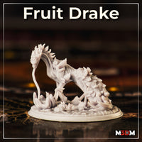 Fruit Drake by Mia Kay M3DM — serpentine drake with a leaf-fringed crest and plant-covered haunches, shown on a plain base, body curved in a sweeping arch with the head lowered toward the ground.