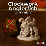 Clockwork Anglerfish Land Variant by Mia Kay M3DM — grey resin print beside a D20 for scale, showing serrated teeth, segmented mechanical limbs, layered fin structures, and a curved pipe lure above the body.