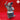 Grey resin render of a platypus folk miniature dressed in a ruffled jester collar and small hat, playing a snare drum with both drumsticks raised — one arm high in the air — viewed from the front at 32mm scale