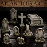 Eight graveyard scatter terrain pieces on a dark reflective surface showing cracked stonework, root-covered bases, a carved sarcophagus with recumbent figure relief, Gothic arched headstones, and a weathered stone cross. Sculpts by Atlanticus Arts.