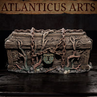 Aged wooden coffin-chest bound with looping rusted chain links draped over the lid and sides, roots and creeping vines threading across the worn planks, a corroded keyhole lock at the front. Rocky and root-scattered base. Sculpt by Atlanticus Arts.
