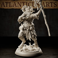 Satyr miniature with curved ram horns, smiling expression, playing pan pipes with one hand and raising a vine-wrapped staff with the other, tattered open shirt and belt of pouches at his waist, thick fur on his lower body, on a debris-strewn scenic base with mushrooms. Sculpt by Atlanticus Arts.