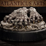 Close overhead view of the Crawling Claws swarm by Atlanticus Arts, showing the mass of reaching fingers spreading outward across a rocky, debris-covered base with visible claw tips and knotted knuckle detail.