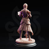 Unpainted resin miniature of Proctor Synthelia by DM Stash — rear view revealing a long detailed braid, full geometric quilting across the coat, belted armour, and the engraved runic base, demonstrating the sculpt's back detail on a black display stand