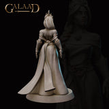 Rear view of the same unpainted grey resin miniature showing the detailed back of a flowing belted robe, trailing fabric, and the horned headdress from behind — Queen to Guard 01 by Galaad Miniatures