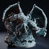 Quorenderi the Deep One Reborn by DM Stash — a massive multi-headed tentacled creature with leathery wings spread wide, clutching a crumbling coastal lighthouse in its clawed limbs, surrounded by crashing waves on the sculpted base.