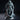 Hooded executioner in layered frayed robes holding two large curved blades, standing over a screaming severed head base, with a ceremonial bell hanging from rope-bound waist. Sculpt by DM Stash.