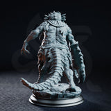 Aberration figure with scaled, segmented legs and a ridged crab claw at its side, barnacle growths across its back, scaled skull crest visible, tail sweeping behind it over a rubble-strewn base. Sculpt by DM Stash.
