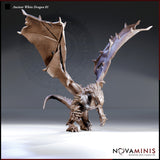 Digital render of the Ancient White Dragon 01 miniature by Novaminis — an unpainted brown resin-coloured dragon shown from the front in a low, aggressive stance with wings spread wide in a V shape, forelimbs braced on the ground, ridged spine and spiked tail visible, head lowered as though preparing to strike