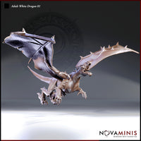 Digital render of the Adult White Dragon 01 miniature by Novaminis — an unpainted grey resin sculpt shown in a dramatic airborne dive pose with wings fully spread, jaws open wide revealing rows of jagged teeth, and both taloned forelegs reaching forward. The underside of the dragon is visible along with a heavily spiked tail and detailed wing membrane texture.