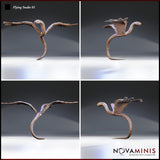 Digital render of Flying Snake 01 miniature by Novaminis shown from four angles — front, rear, top-down, and side profile — highlighting the feathered wings, smooth serpentine body, and landing pose, unpainted clay render