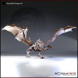 Digital render of Young Black Dragon 02 miniature by Novaminis — front-facing pose with wings fully spread, one foreclaw raised, jaws open in a snarl, dorsal spines bristling, shown unpainted in grey resin finish against a light background