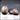 Digital render of Dragon Eggs 03 by Novaminis — two resin dragon egg terrain pieces, one whole and upright with overlapping scales, one cracked open with a jagged broken shell rim and hollow interior visible, shown against a neutral grey background