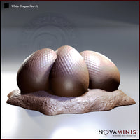 Digital render of a White Dragon Nest miniature by Novaminis, showing three large scale-textured dragon eggs clustered together on a rough rocky base, viewed from a slightly elevated front angle. The eggs display a detailed diamond-pattern scale texture across their upper surfaces with smoother undersides. Warm brown and pale mauve tones across the sculpt.