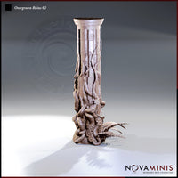 Digital render of Overgrown Ruins 02 — a tall classical stone column partially cracked and almost entirely consumed by thick gnarled roots, vines, wild flowers, and leaf debris spiralling up from the base. Shown from a front three-quarter angle against a neutral grey gradient background.