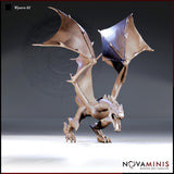 Digital render of the Novaminis Wyvern 02 miniature in unpainted resin, shown in a three-quarter front view. The wyvern stands with forelimbs braced on the ground, jaws open wide in a threat display, dorsal spines raised along neck and back, and both large leathery wings spread high above its body. The wing membranes show ribbed strut detail and subtle tonal variation.