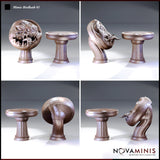 Novaminis Mimic Birdbath 01: four angles of both sculpts — the round disc-bodied mimic lunging with open jaws and the calm birdbath form, showing the fleshy textured body and pedestal base from multiple perspectives.