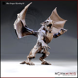 Snarling blue dragon wyrmling rearing upright, wings fully spread, one foreleg raised with claws extended, jaws wide open. Scaled body with pronounced horns and a thick tail. Sculpt by Novaminis.