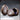 Two Novaminis dragon egg sculpts side by side — one intact with tessellated scale-plate texture across the whole shell, one cracked open with a hollow dark interior and broken rim.