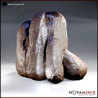 Three rounded stone pillars clustered together, the tallest rising to a blunt peak, with deep fissures running between them. Heavy textured surfaces show cracked, weathered rock. Sculpt by Novaminis.