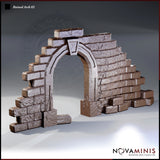 Novaminis Ruined Arch 02 — a crumbling gothic stone arch with a carved keystone, flanked by two uneven sections of stepped, heavily textured brickwork in varying states of collapse.