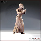 Novaminis Beggar 02 resin miniature render — slender female figure standing barefoot in a long patched robe with cross-stitched hemline and rope belt, hair hanging over a bowed face, hands pressed together in a pleading or praying gesture