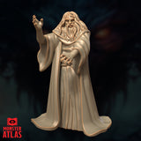 Digital render of an unpainted archmage miniature at 32mm scale, sculpted by Monster Atlas — an elderly long-haired bearded man in sweeping robes, right hand raised commandingly and left hand curled inward in a spellcasting gesture, with an intense and imperious expression
