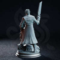 Lean male character in a buttoned coat and bandage-wrapped wrists, holding a large bone saw aloft with a wide unsettling smile. Sculpt by DM Stash.